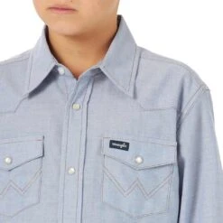 Wrangler Boys' Cowboy Cut Chambray Snap Shirt -Wrangler || Schleich || ROPER Shop img33391 wrangler boys cowboy cut chambray snap shirt